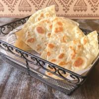 Paratha · Pan grilled multi layered bread. Freshly prepared in our tandoor.
