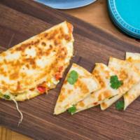 Quesadilla · Flour tortilla with melted cheese and green onion served with tomato, lettuce, guacamole and...