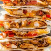 Steak Fajita Quesadilla · Steak with bell peppers, onions and mushrooms. Served with sour cream and guacamole.