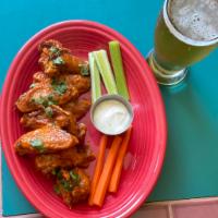 12 buffalo wings  · freshly made from scratch buffalo wings drenched in hot fire sauce made from our chefs, serv...