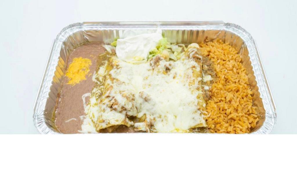 Enchiladas Verdes · 3 pork enchiladas deliciously smothered with our green tomatillo sauce and garnished with sour cream and lettuce. Served with rice and beans.