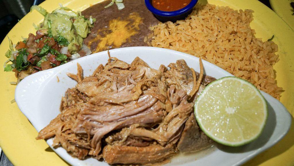 Pork Carnitas · Roasted pork meat cooked in its own juice with great flavored spices. Served with pico de gallo, guacamole, rice, beans and tortillas.