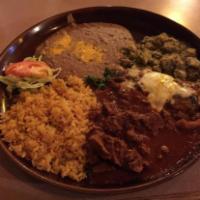 Tres Compadres · Chile verde chile colorado and 1 chile relleno with a side of pinto beans, rice and tortilla...