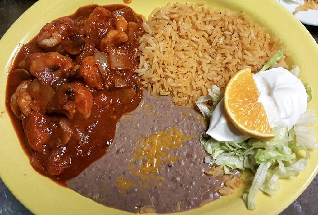 Camarones a la Diabla · Fresh, spicy, delicious prawns cooked with mushrooms, onions and tomatoes simmered with our hot medium sauce. Served with rice and pinto beans or substitute black beans.