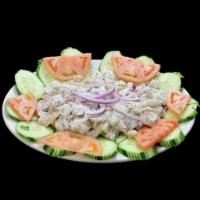 Camarones Ahogados · 14 shrimp. Fresh whole prawns marinated with lime juice, tomatoes and onions.