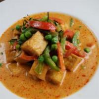 Panang Curry · Panang curry paste, bell pepper, green pea and kaffir lime leaves. Spicy.