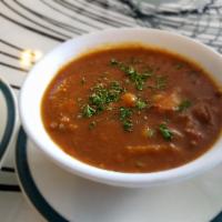 Cup of Goulash Soup · A spicy stew made from onions, peppers, root vegetables, tomatoes, paprika and lots of beef.
