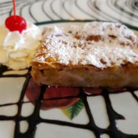 Applestrudel · Served warm with whipped cream.