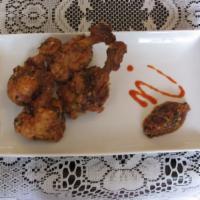 MB Chicken Wings · Marinated Chicken Wings with fresh herbs and chili garlic sauce.
