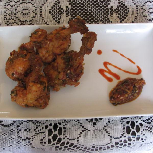 MB Chicken Wings · Marinated Chicken Wings with fresh herbs and chili garlic sauce.