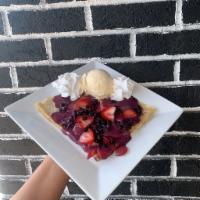 Berry Blast Crêpe · Sweet and tart, this crepe comes with fresh strawberries and blueberries and is covered in o...