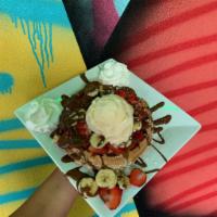 Strawberry Banana Nutella Waffle · Topped with slices of fresh strawberry and banana, and drizzled with Nutella®.  Comes topped...