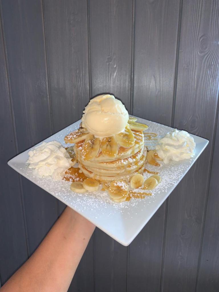 Banana Temptations · We're not monkeying around with these pancakes.  Enjoy fresh slices of banana and caramel sauce on this tempting treat.  Comes topped with whipped cream and one scoop of either vanilla, chocolate, or strawberry ice cream!