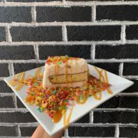 Fruity Pebbles ® Ice Cream Cake · A rainbow delight; our Fruity Pebbles ® ice cream paired with vanilla cake.  Comes topped wi...