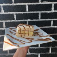 Dulce de Leche Ice Cream Cake · Sweet and creamy all around.  Delight yourself with vanilla cake & Dulce de Leche ice cream,...