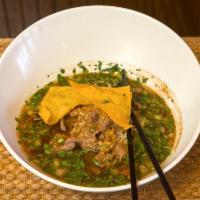 Ba Mee Nuer · Rice noodles soup with sliced beef, bean sprouts and scallions in a beef flavored soup, topp...