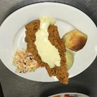 Chicken Fried Steak · Topped with milk gravy or spicy gravy, served with mashed potatoes and cole slaw.