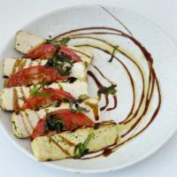 Tofu Caprese · Herb Grilled Organic Tofu / Heirloom Tomatoes / Balsamic Reduction / Olive Oil / Mint