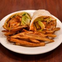Buffalo Chicken Wrap · Chicken breast smothered in a homemade Buffalo sauce and wrapped in a flour tortilla with le...