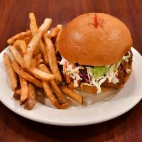 Pulled Pork Sandwich · Marinated and slow smoked BBQ pork shredded on a challah bun. Served with fries.