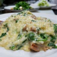 Risotto Pugliese · Risotto with spicy Italian sausage and broccoli rabe.