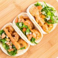 Small Grilled Shrimp Taco · Small soft corn tortilla, lettuce, pico de gallo, and chipotle-sour cream.Add toppings for a...