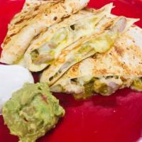 Quesadilla Grande · Flour tortilla filled with your choice of meats, mozzarella cheese with guacamole and sour c...