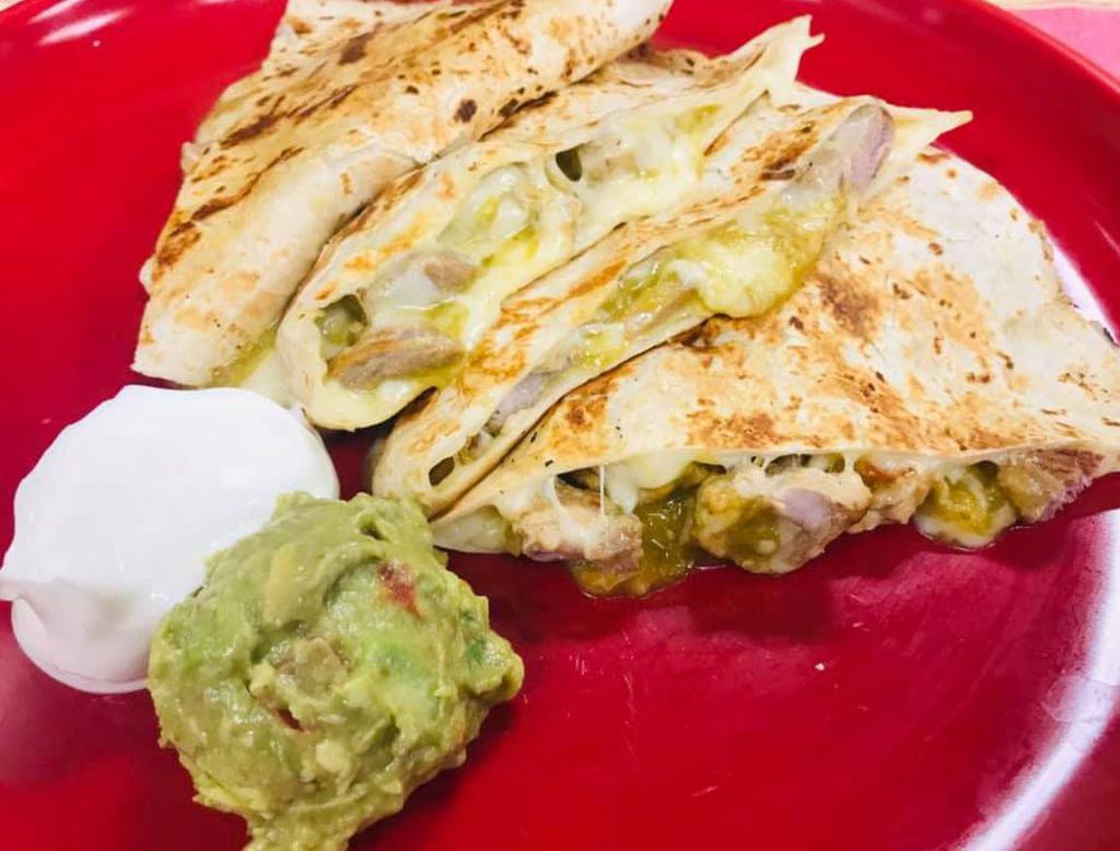 Quesadilla Grande · Flour tortilla filled with your choice of meats, mozzarella cheese with guacamole and sour cream.