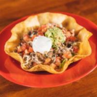 Traditional Taco Salad  · Served with your choice of meat with beans, shredded lettuce, tomatoes, cheese, sour cream a...