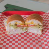 Turkey Breast Sandwich · Mayonnaise, Mustard, Provolone cheese,  Lettuce, Tomato, Pickles, Peperoncinis