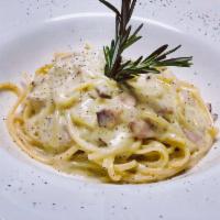 La Carbonara · Spaghetti, smoked pancetta, egg yolk, onions and pecorino Romano.