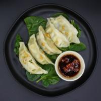 Dumpling ·  Steamed or fried dumpling served with sweet soy sauce.