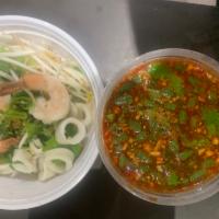 CR6. Seafood Noodles Tom Yum Soup · Rice noodles with scallion, beansprout, chopped string bean and ground peanut in spicy sour ...