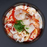 S4. Tom Kha Talay Soup · Thailand's signature hot and sour soup made of seafood mixed, galangal and lemongrass with c...