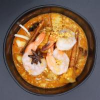 C3. Massamum Curry · Rich and spicy southern Thai curry with onions, coconut milk, potatoes and peanuts. Vegetari...