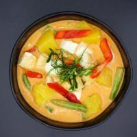 C5. Panang Curry · Slightly sweet and spicy with string beans, bell peppers, Carrot and kaffir lime leaves.