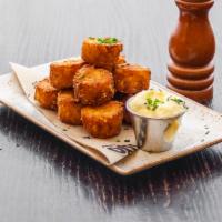 Truffled Tots · House-made with truffle infused aioli and chives.