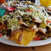 3A Nachos · your choice of chicken or ground beef with beans, sour cream, onion, tomato, lettuce, jalape...