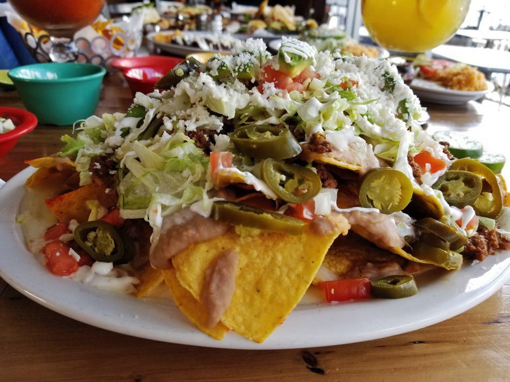 3A Nachos · your choice of chicken or ground beef with beans, sour cream, onion, tomato, lettuce, jalapeno & queso fresco