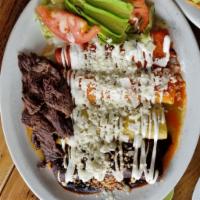 Enchiladas Mixtas · Our four signature sauces with your choice of meats, served with a side of grilled steak