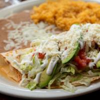 Quesadilla Especial · Your choice of meat folded in a flour tortilla with cheese topped with lettuce, tomato, onio...