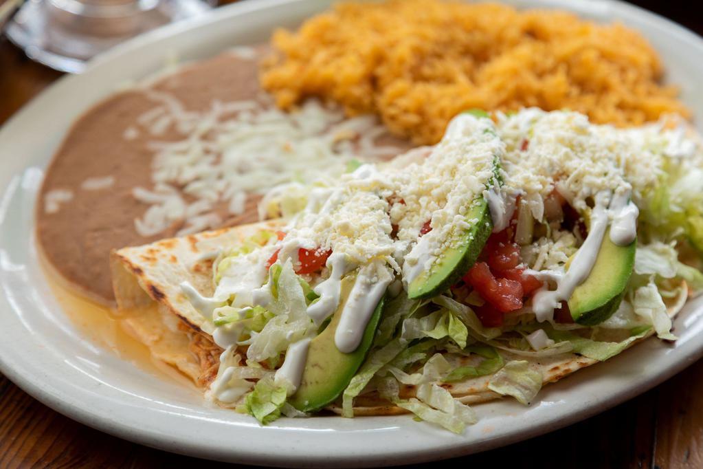 Quesadilla Especial · Your choice of meat folded in a flour tortilla with cheese topped with lettuce, tomato, onion, queso fresco & sour cream