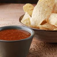 Chips and Salsa · Thinly sliced and crispy. Dip made from tomatoes and onions. 