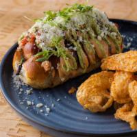 Sonoran Dog · Bacon wrapped Kobe dog with black beans, pico, avocado crema, chipotle aioli. Served with ch...
