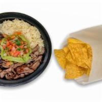 CARNE ASADA BOWL · Grilled Beef served in a delicious bowl with vegan lime rice and vegan black beans,  topped ...