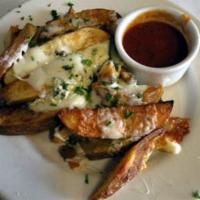 Italian Fries · Steak fries seasoned with Italian herbs baked in the over with mozzarella and blue cheese.