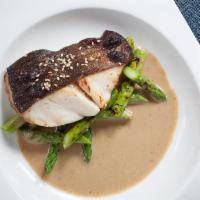 Miso Black Cod · Served with grilled asparagus.
