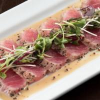 Seared Tuna  · Seared tuna with a creamy wasabi sauce; topped with organic micro greens
