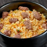 Umami Steak Fried Rice · Rice, steak, egg, chopped vegetables garlic sauce