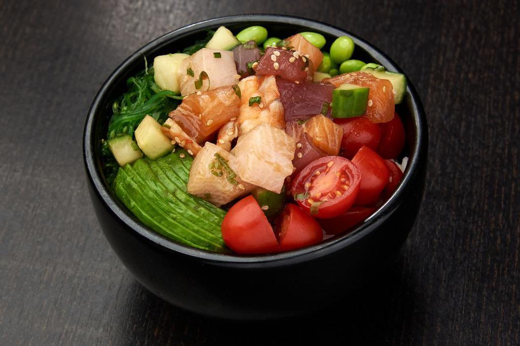 BARA CHIRASHI POKE BOWL · Ahi tuna, salmon, yellowtail, shrimp, cucumber and green onions mixed in poke sauce; served with grape tomatoes,
avocados, edamame and seaweed salad; topped with sesame seeds